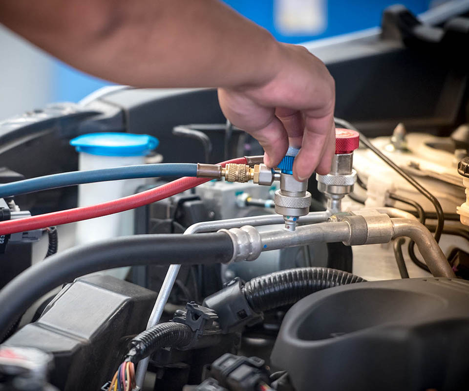 Servicing car air conditioner. Service station. Car repair. auto mechanic Check the pressure and leak. for use on air condition systems