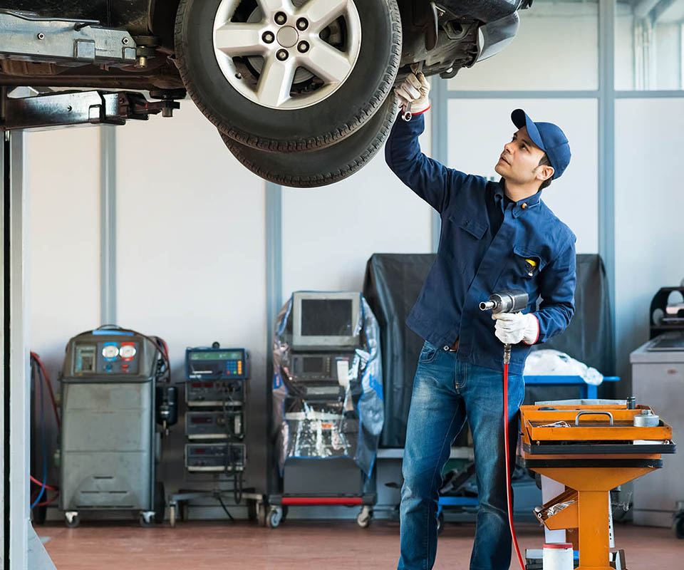 Portrait of a mechanic at work in his garage